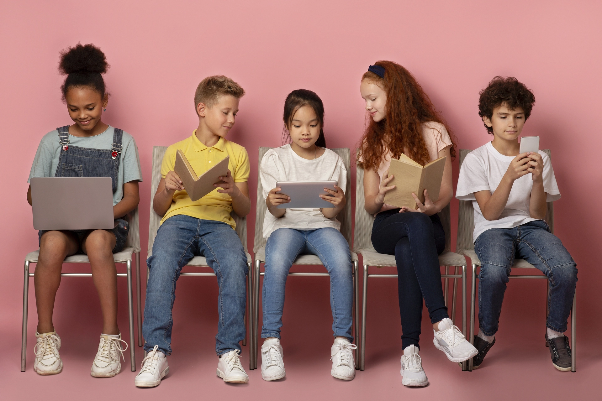 children using laptops and mobile phones